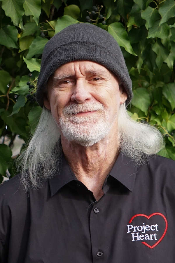 Steve Smithson - Staff Photo wearing a black Project Heart button up shirt